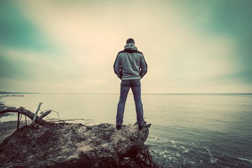 Life in Alcohol Addiction Recovery - man standing by lake - waypoint recovery center