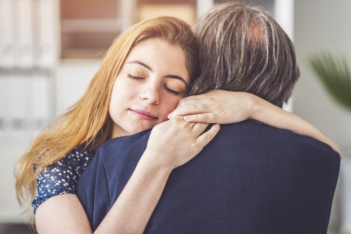 woman embracing her father