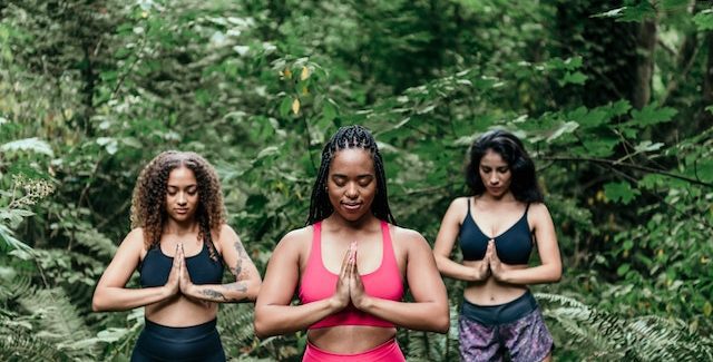 Grounding Techniques - Photo by PNW Production: https://www.pexels.com/photo/women-wearing-sports-bra-meditating-in-the-woods-8980969/